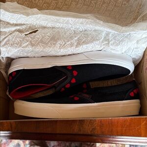 Vans Black Slip-On Sneakers with Red Heart Accents